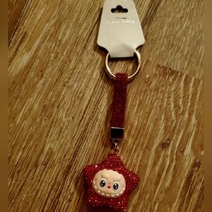 Sparkling Red Star Keychain by [Brand]
